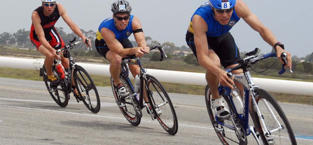 070728-N-1722M-178 POINT MUGU, Calif. (July 28, 2007) - Two Navy triathletes lead the way during the cycling portion of the Armed Forces Triathlon at Point Mugu. The triathlon, held at Naval Base Ventura County, consisted of a 1.5-kilometer swim, 40-kilometer bike ride and a 10-kilometer run. U.S. Navy photo by Mass Communication Specialist 1st Class Michael Moriatis (RELEASED)